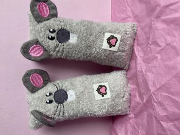 Grey cat plushie with pink accents.