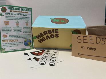 Your Herbie Head-Barry Basil character kit, which includes seeds, soil, a customisable bamboo pot with decorations, and information leaflet.