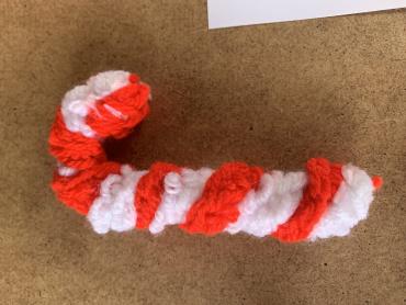 A picture of a crochet candy cane