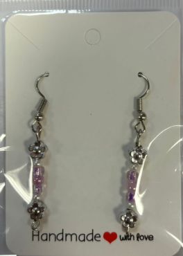 silver hook earrings with a silver, white and purple colour scheme and a silver flower