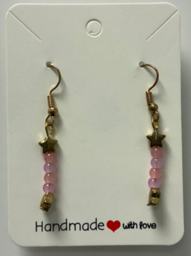 A earring with a golden hook with a golden star and having 2 pink and purple beads interchangeably