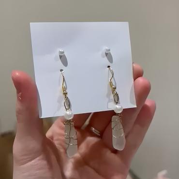 white sea glass pendants wire wrapped with pearls, packaged as earrings
