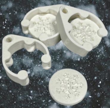 Trolley token with snowflake design in white.