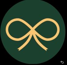 The logo shows a simple golden ribbon bow in the centre of a dark green circular background.