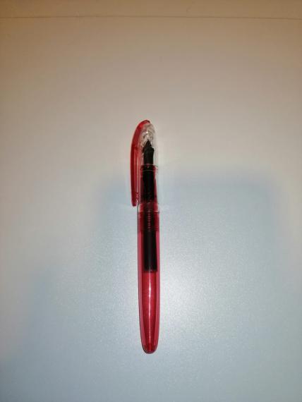 Red pen, black ink, cedar scented.