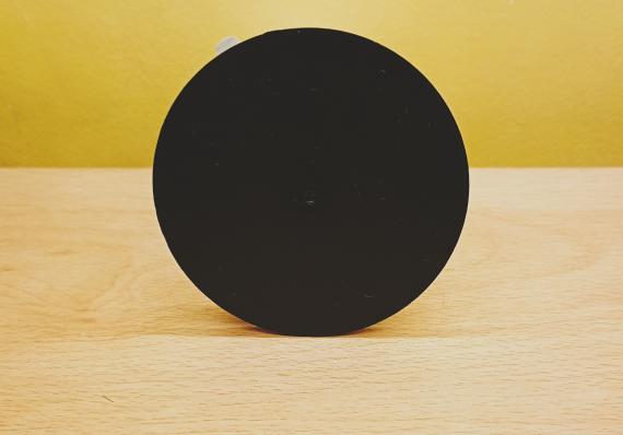 A plastic disk to attatch to any surface