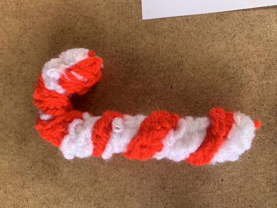A picture of a crochet candy cane
