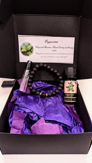 An image of our signature Scentra Box that includes one sfragrance essential oil and the iconic Scentra bracelet.