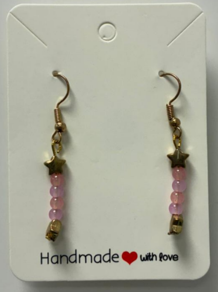 A earring with a golden hook with a golden star and having 2 pink and purple beads interchangeably