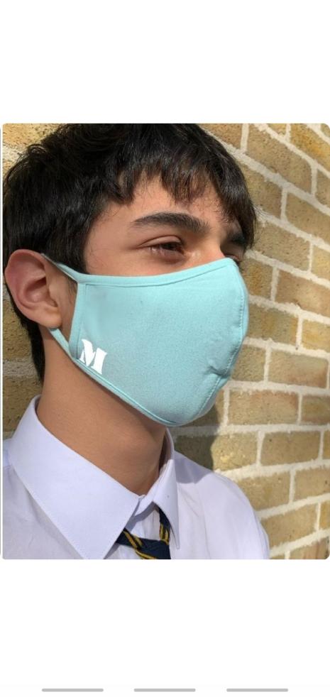 Light blue face-mask with patches that are available in black and white color