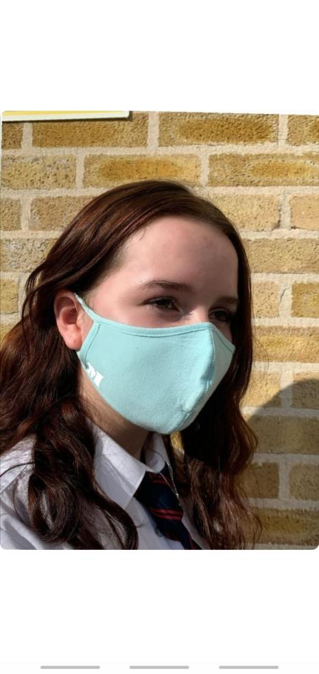 Light blue face-mask with patches that are available in black and white color