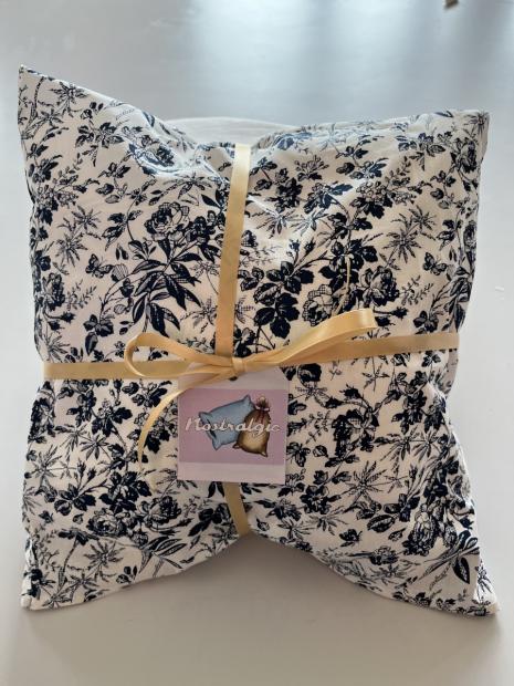 White pillow with black flower pattern