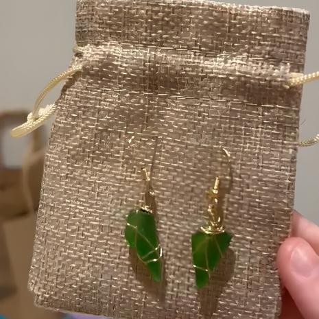 green sea glass pendants wire wrapped in gold wire packaged as earrings