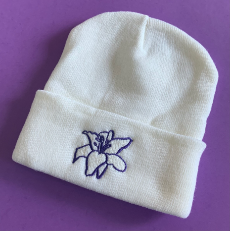 white beanie with purple embroidery