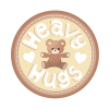 A teddy bear with open arms in a circle surrounded by the words 'Heavy Hugs' with a heart on either side of its arms 