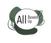 The logo for "All Boxed Up" features the brand name in black text within a white oval, surrounded by green leaf drawings and shapes.